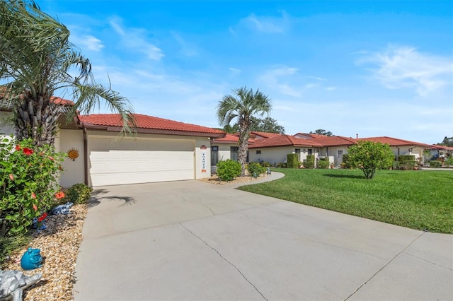 view of front of home featuring a front yard and a garage