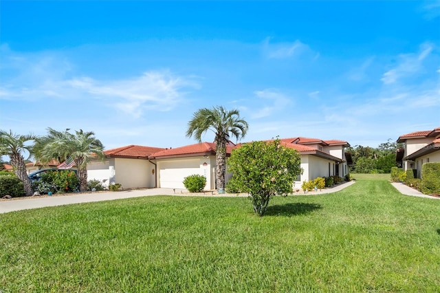 mediterranean / spanish-style house featuring a front lawn and a garage