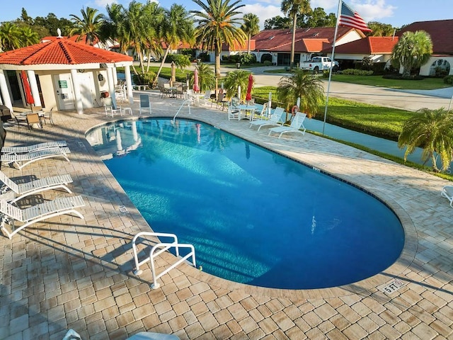 view of pool featuring a patio