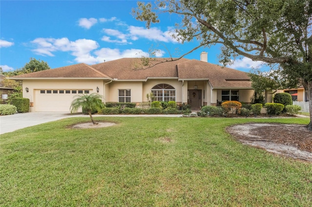 ranch-style home with a garage and a front lawn