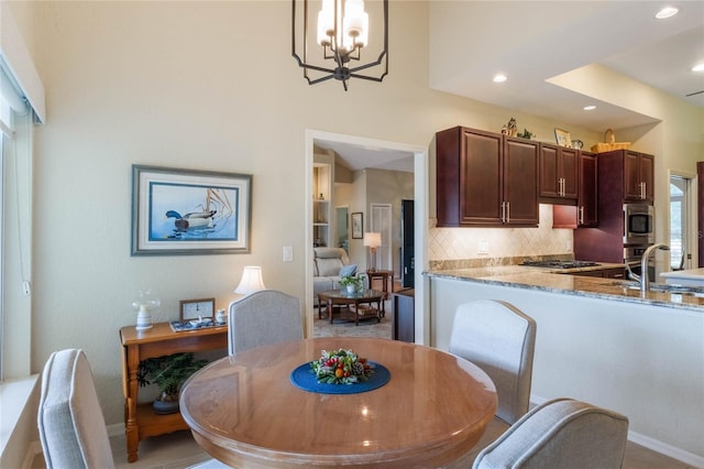 dining area with an inviting chandelier