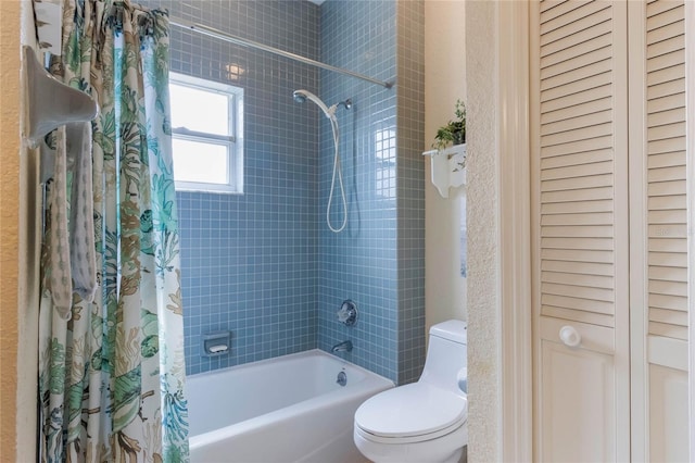 bathroom with toilet and shower / bath combination with curtain