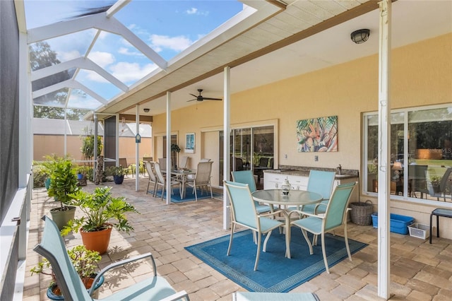 view of patio with a lanai and ceiling fan