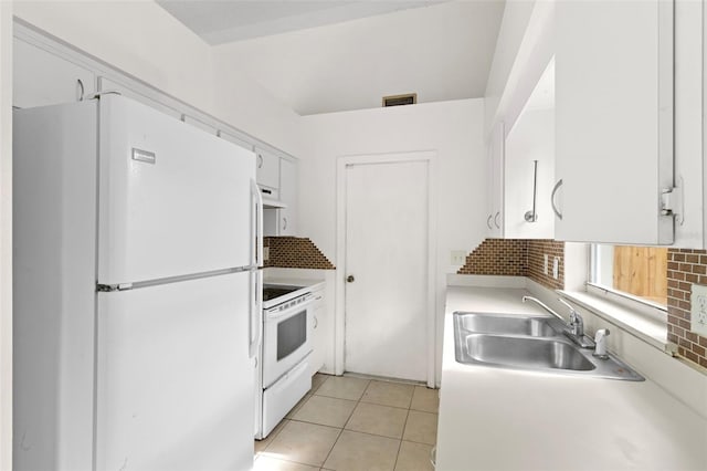 kitchen with sink, backsplash, white appliances, range hood, and white cabinets