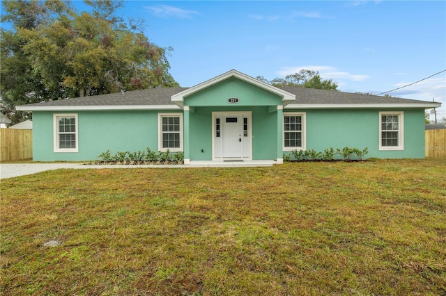 single story home featuring a front lawn