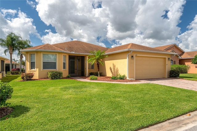 view of front of house featuring a garage and a front lawn