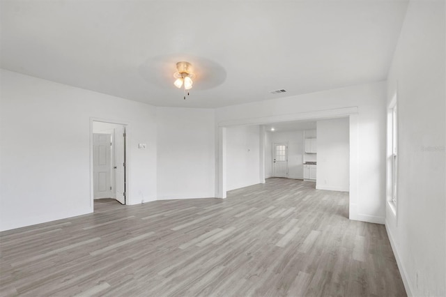 unfurnished living room featuring light hardwood / wood-style floors and ceiling fan