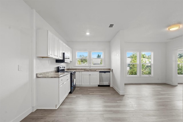 kitchen with white cabinets, black range with electric cooktop, plenty of natural light, and dishwasher