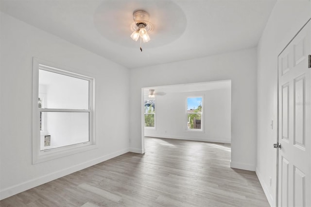 spare room with ceiling fan and light hardwood / wood-style flooring