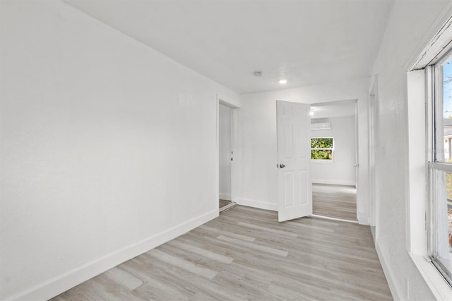 spare room with light hardwood / wood-style floors