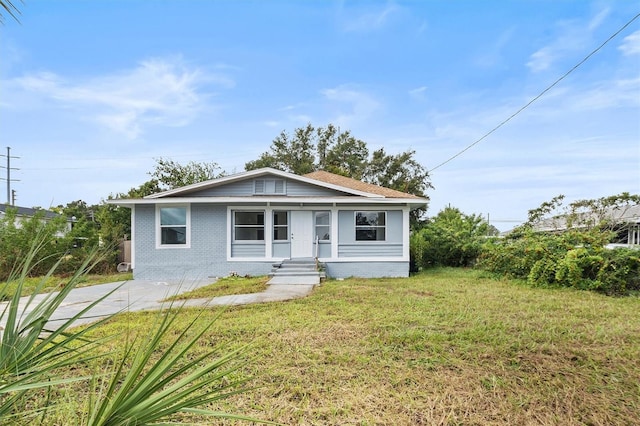 bungalow with a front yard