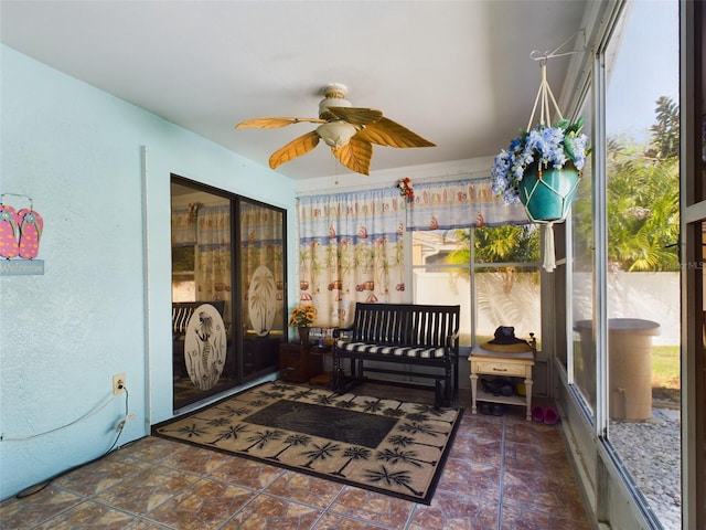 sunroom / solarium with ceiling fan