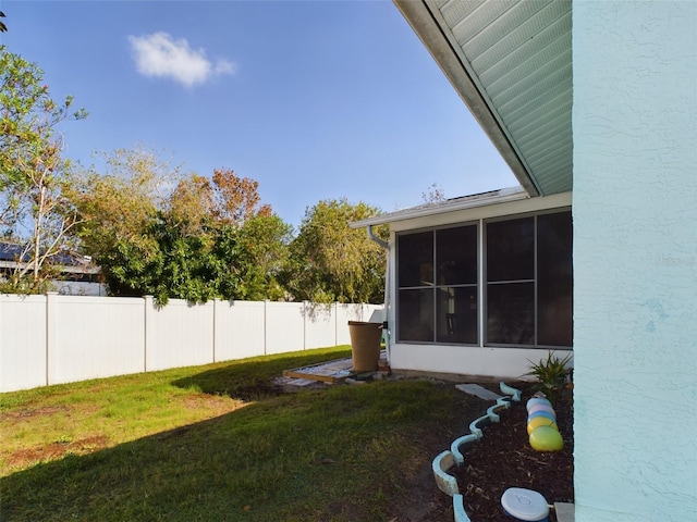 view of yard featuring a sunroom