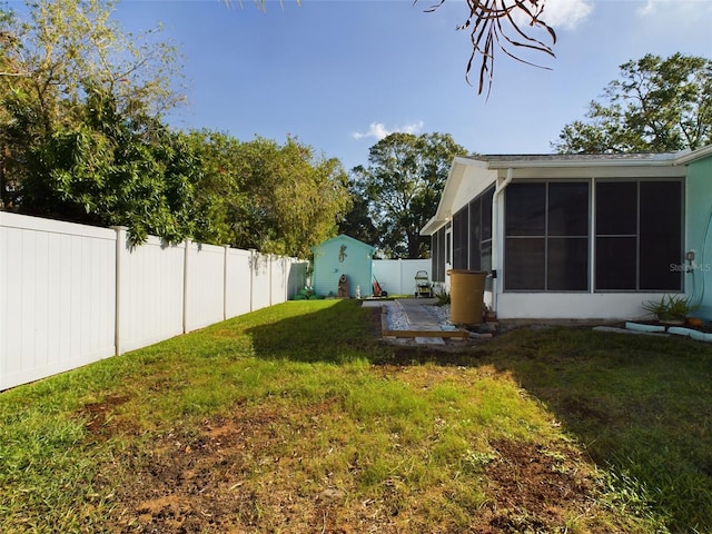 view of yard with a patio and a sunroom