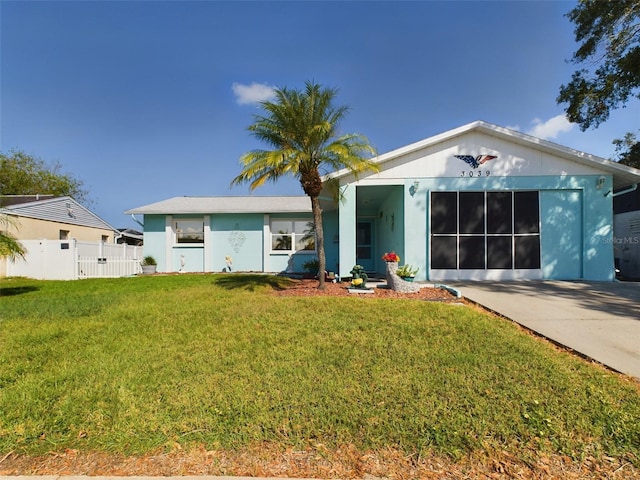 view of front of house with a garage and a front yard