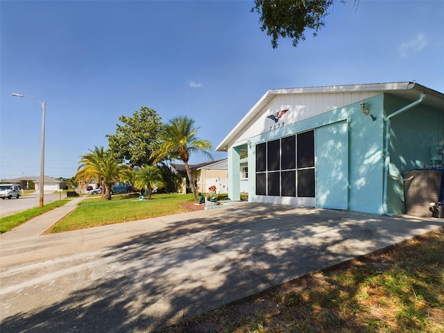 view of side of home featuring a yard