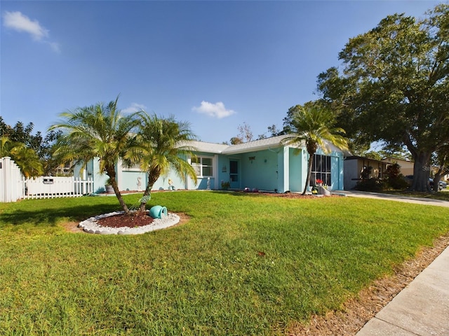 single story home with a front yard