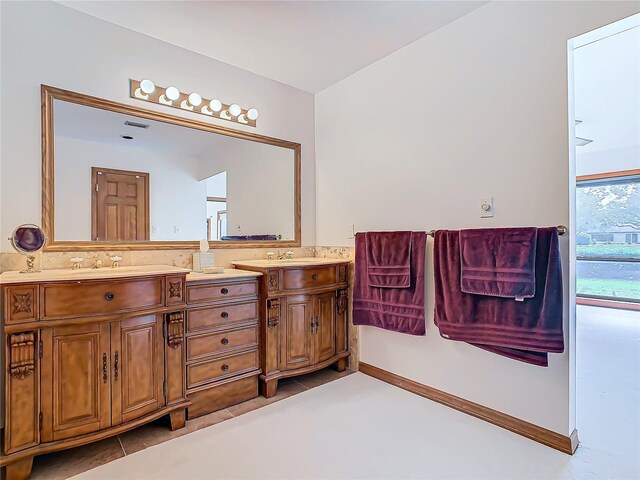 bathroom featuring tile patterned flooring and vanity