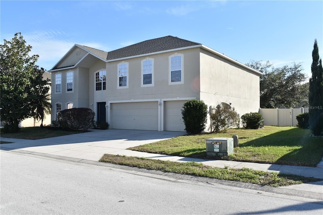 view of front property with a garage and a front yard