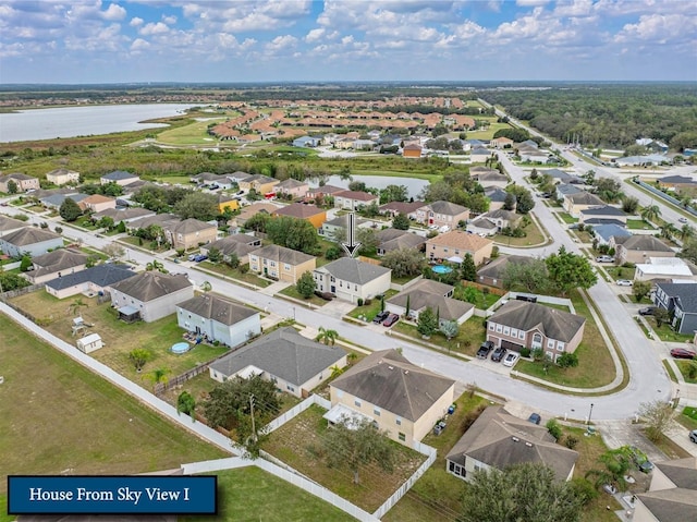 birds eye view of property featuring a residential view and a water view