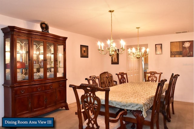 dining space with light carpet, baseboards, visible vents, and a chandelier