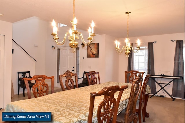 dining room with carpet floors and an inviting chandelier