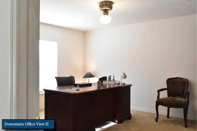 home office featuring light carpet and baseboards