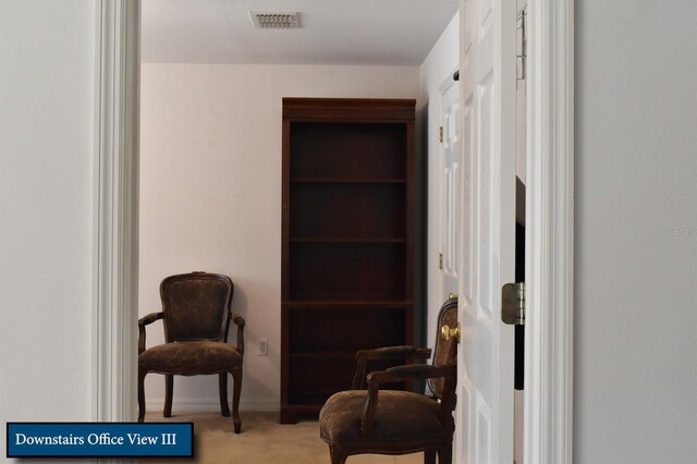 sitting room with carpet, baseboards, and visible vents
