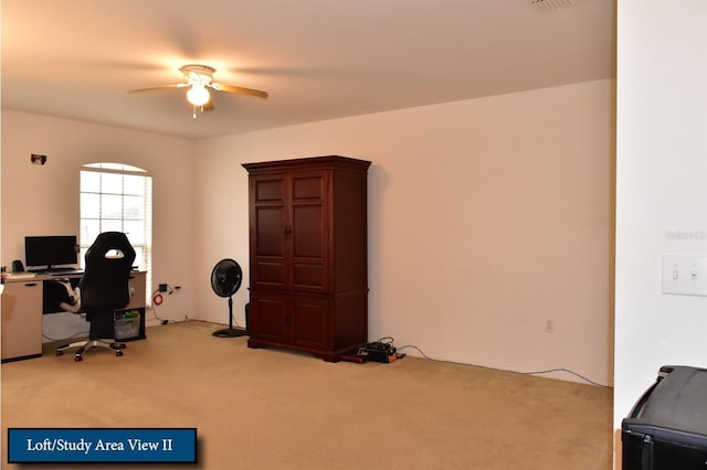 office with visible vents, carpet flooring, and a ceiling fan