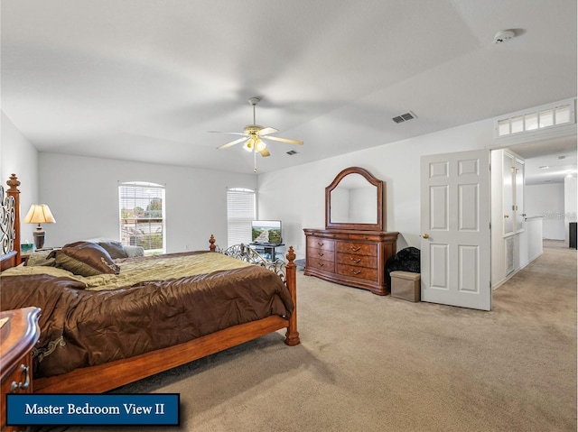 bedroom with light carpet, ceiling fan, and visible vents