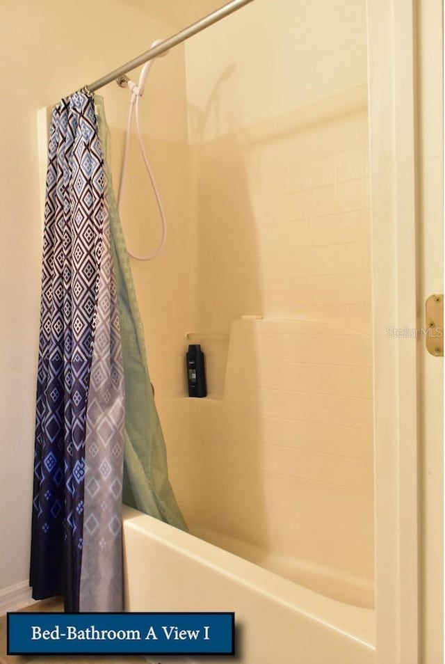 full bathroom with shower / bath combo
