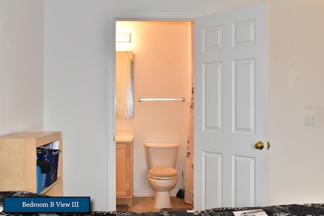 bathroom with toilet and vanity