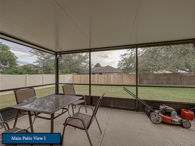 sunroom with outdoor dining area
