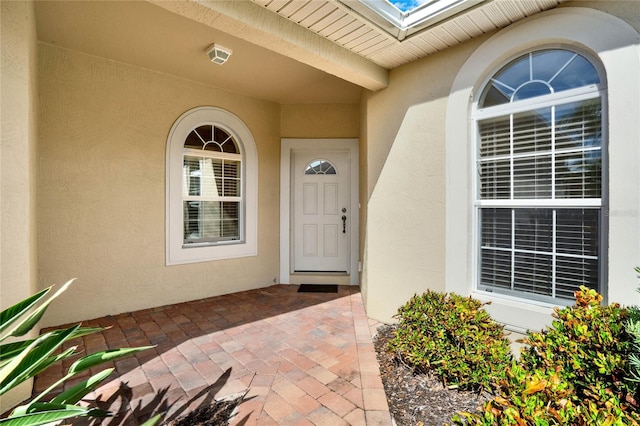 property entrance with a patio