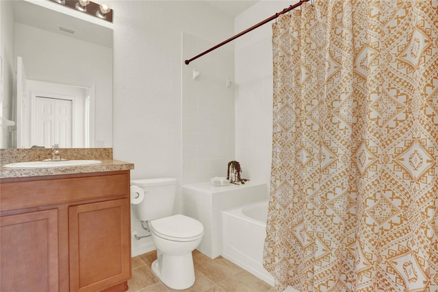 bathroom featuring vanity, tile patterned floors, and toilet