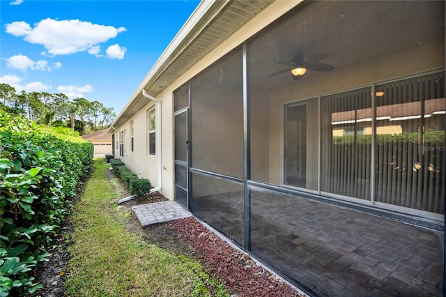 exterior space featuring ceiling fan