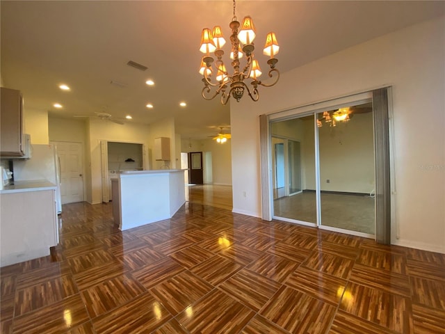 interior space with ceiling fan with notable chandelier