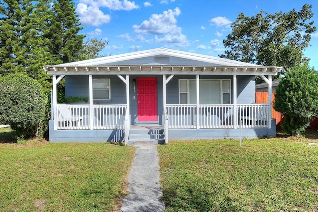 bungalow featuring a front yard and a porch