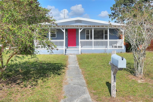 bungalow-style house with covered porch and a front lawn