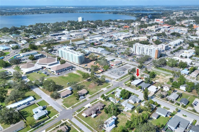 birds eye view of property with a water view