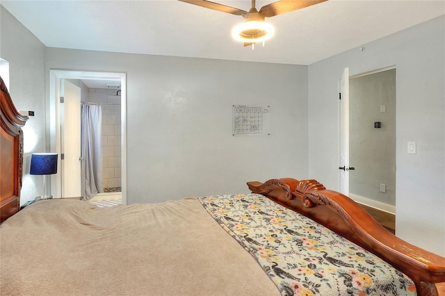 bedroom with carpet flooring, ceiling fan, and ensuite bath