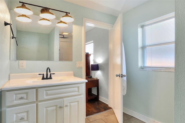 bathroom with tile patterned flooring and vanity