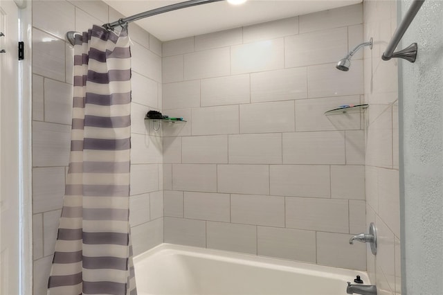 bathroom with shower / bath combination with curtain