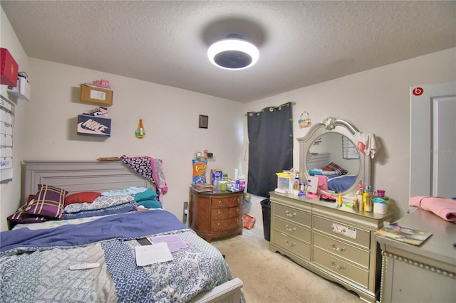 carpeted bedroom featuring a textured ceiling