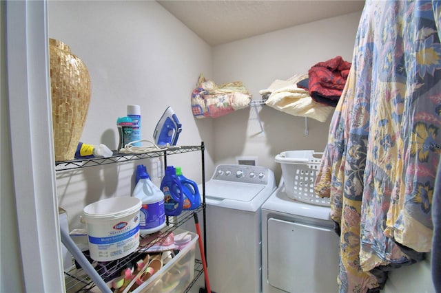 laundry room with washing machine and clothes dryer