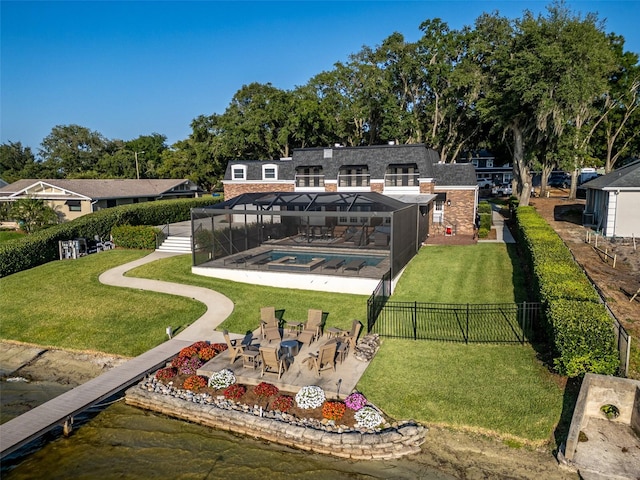 surrounding community with a water view, a pool, a patio area, and a lawn