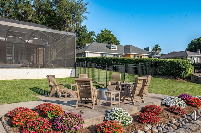 view of patio with a lanai and an outdoor fire pit