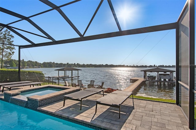 dock area featuring glass enclosure, a patio area, a water view, and a pool with hot tub