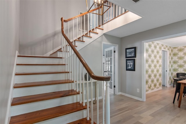 staircase with hardwood / wood-style flooring