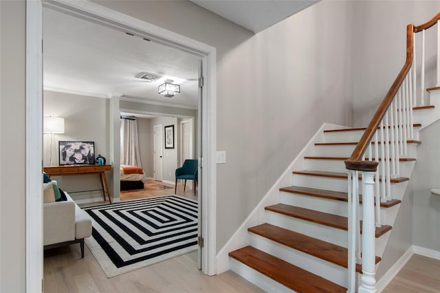 stairway with hardwood / wood-style floors